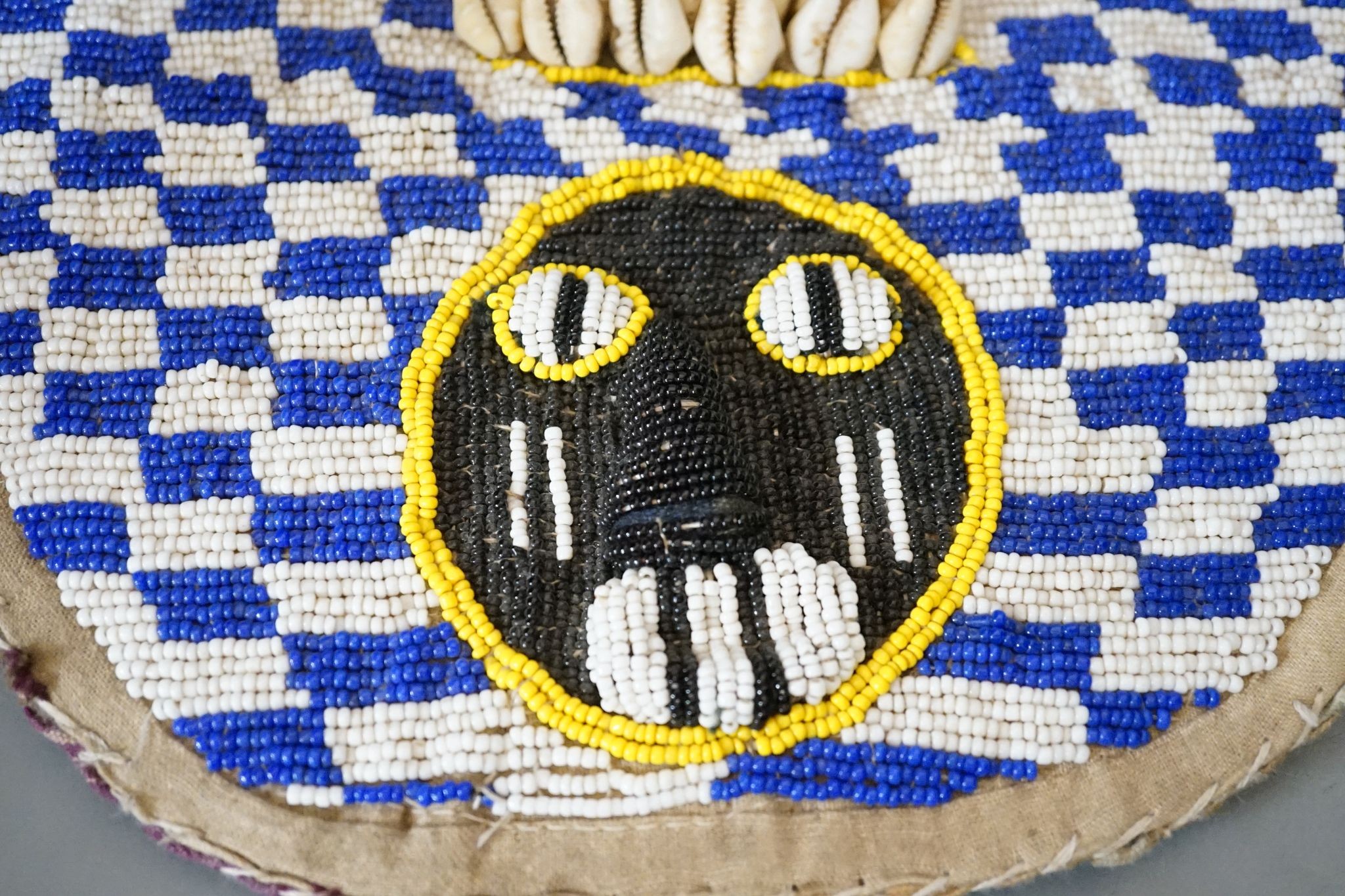 A large African beadwork necklace and three beadwork bags